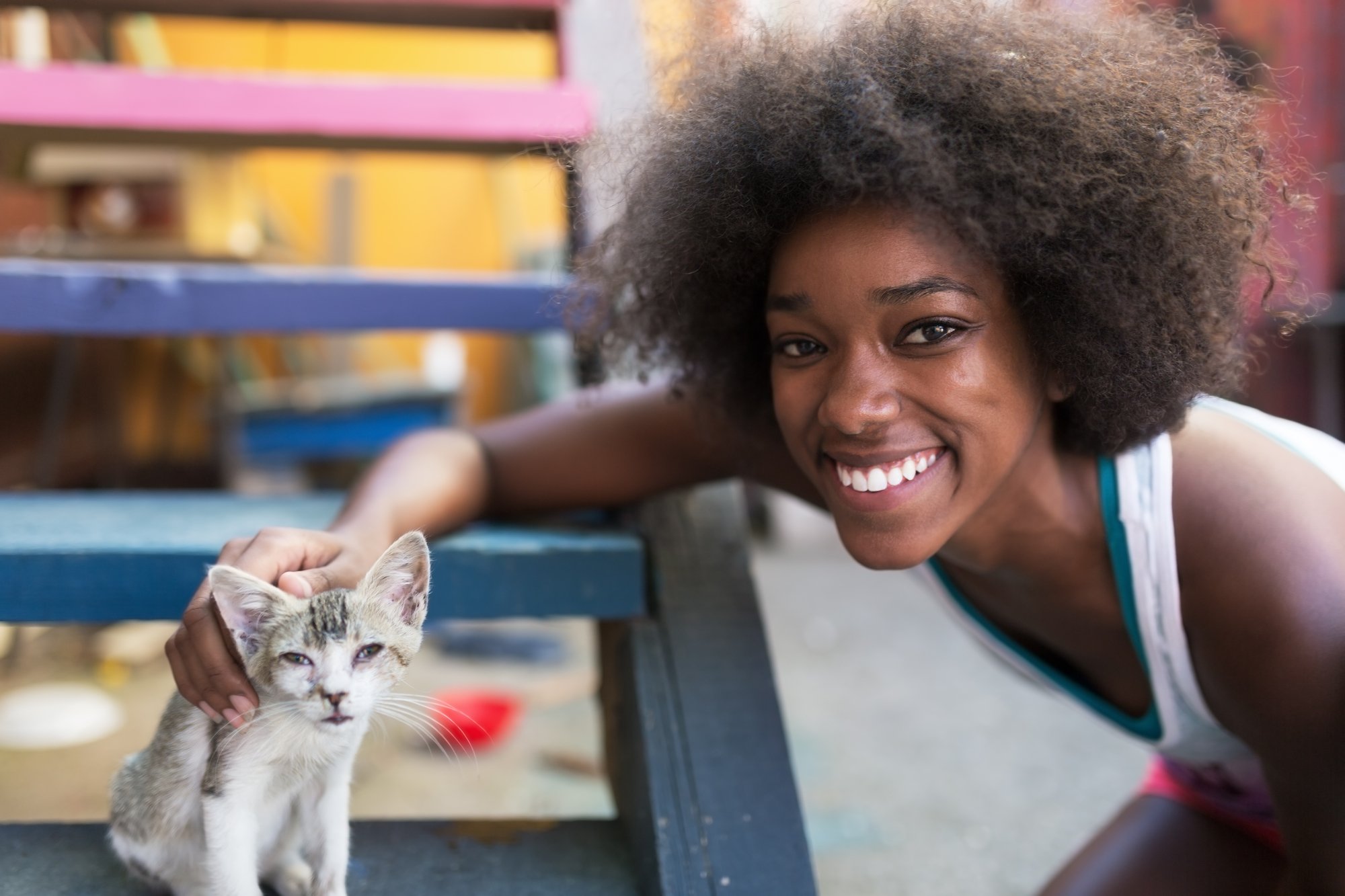 Afro woman with cat