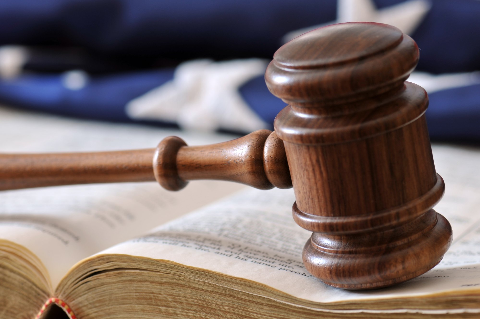Gavel, book, and flag background