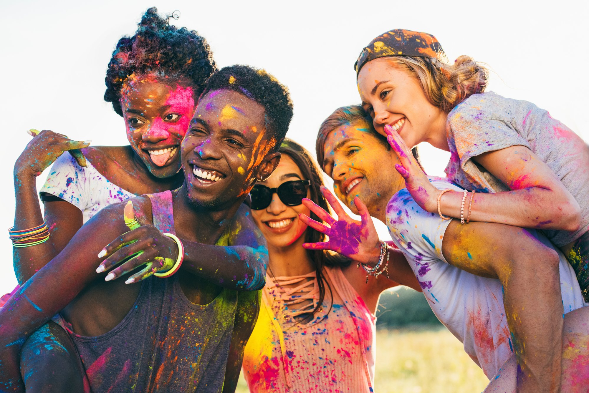 Multicultural friends at holi festival