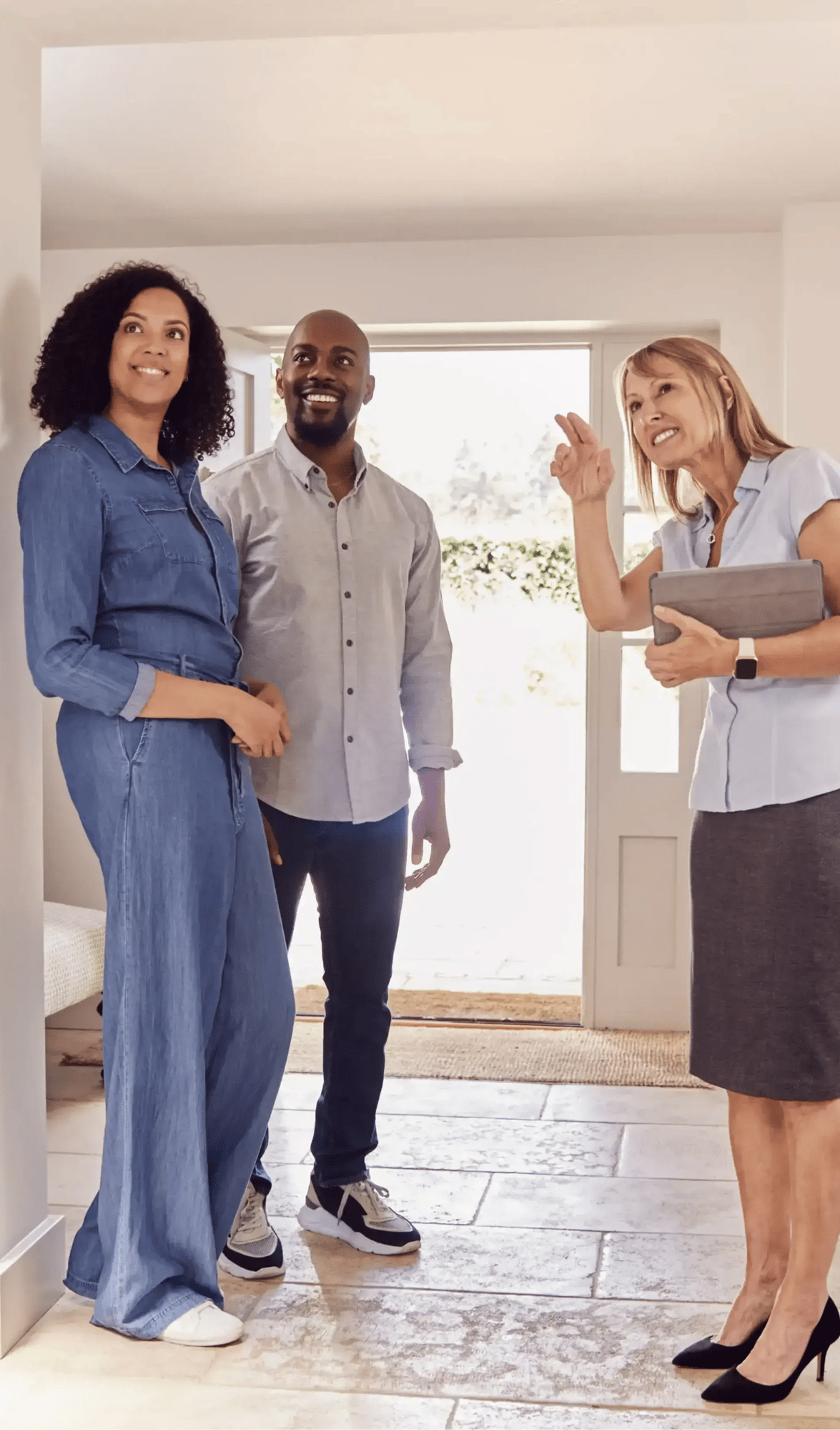 Couple viewing potential home with agent