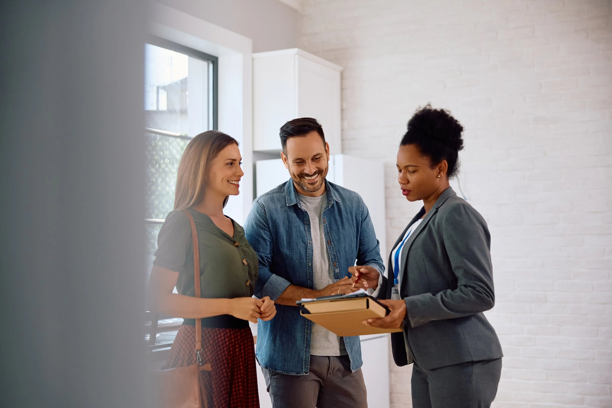 happy-couple-and-real-estate-agent-going-through-l-2024-09-05-21-46-02-utc happy-couple-and-real-estate-agent-going-through-l-2024-09-05-21-46-02-utc
