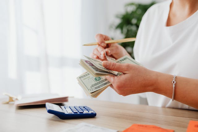 person-calculating-money person-calculating-money