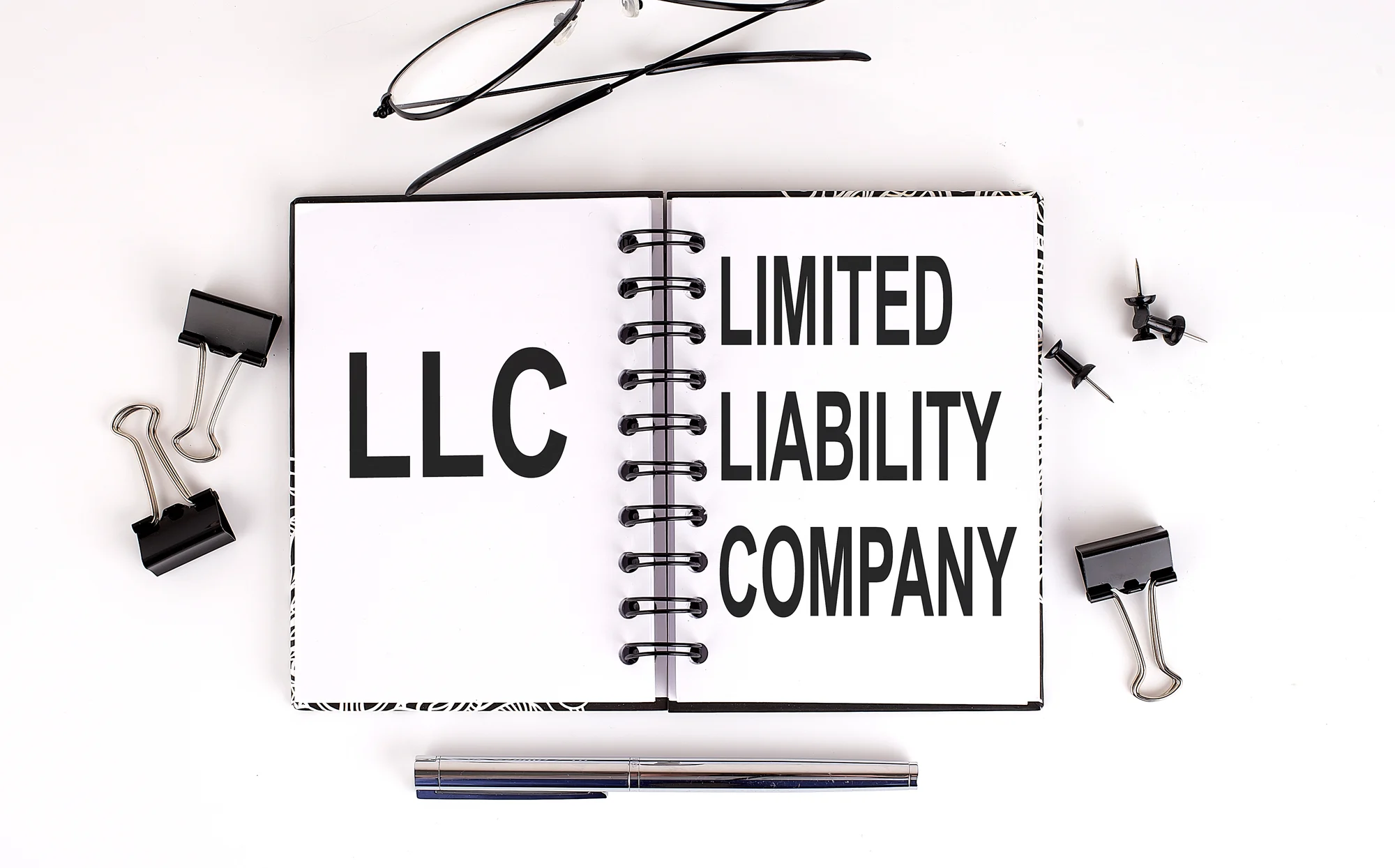 Notebook_20with_20LLC_20Limited_20Liability_20Company_20on_20the_20table_20with_20office_20tools Notebook_20with_20LLC_20Limited_20Liability_20Company_20on_20the_20table_20with_20office_20tools