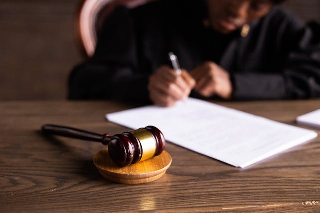 judge-and-their-hammer-on-desk judge-and-their-hammer-on-desk