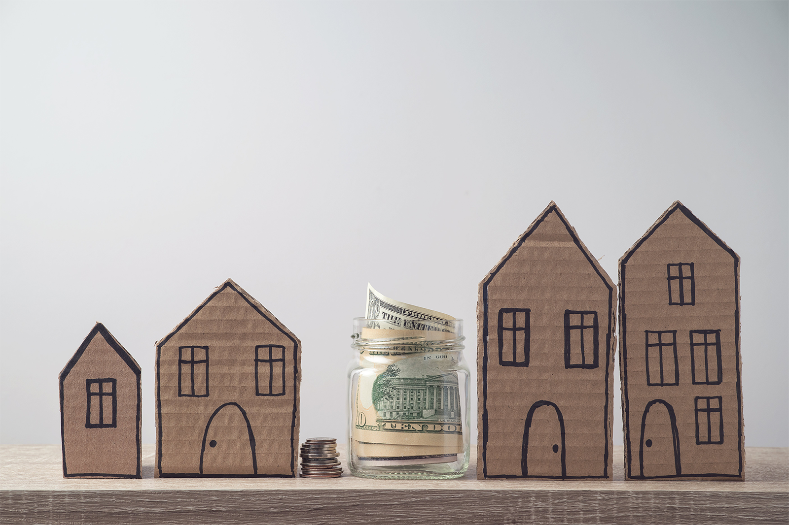 Property_20investment_20and_20house_20mortgage_20financial_20concept_20with_20money_20and_20cardboard_20houses Property_20investment_20and_20house_20mortgage_20financial_20concept_20with_20money_20and_20cardboard_20houses