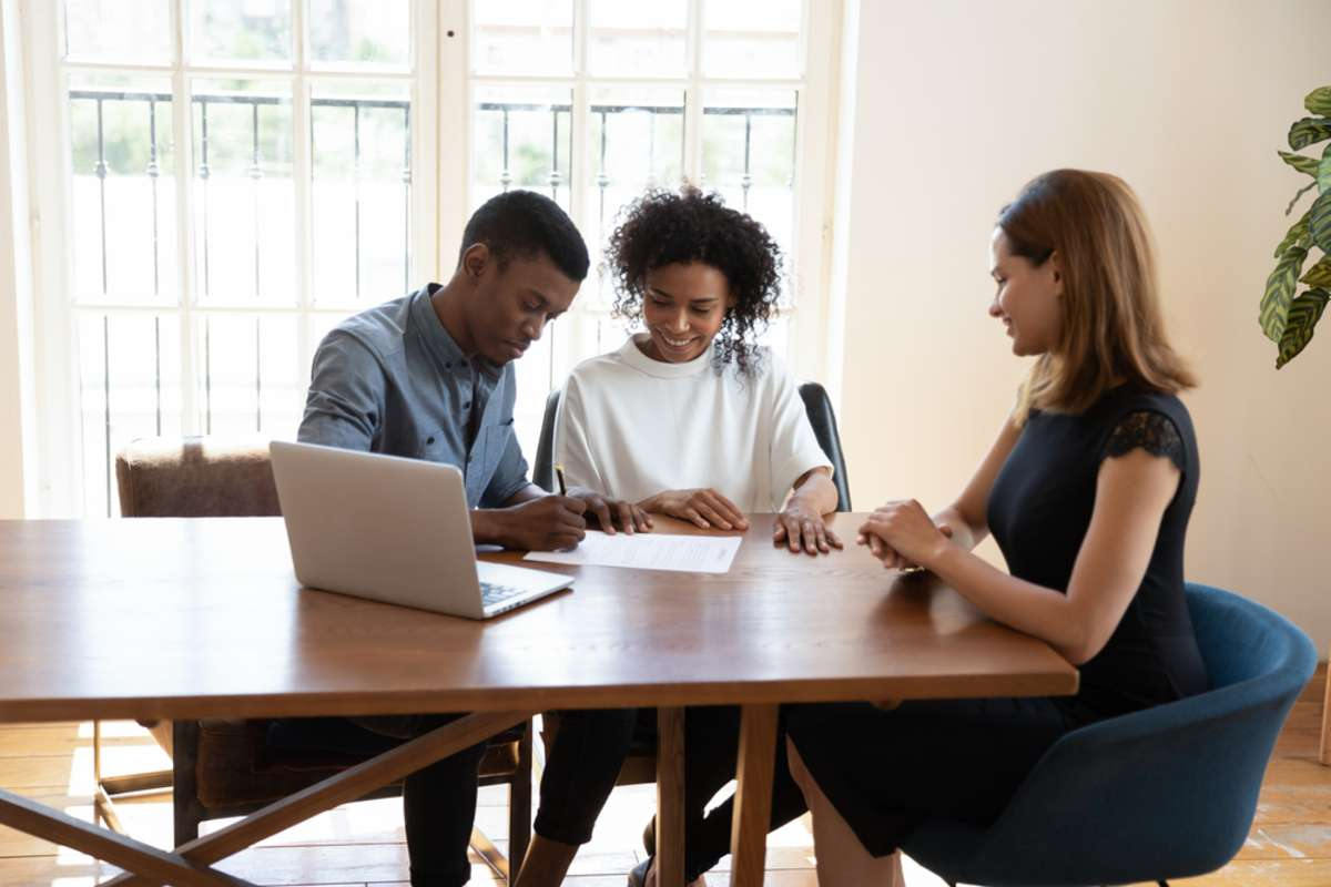 Smiling_20millennial_20african_20american_20family_20couple_20signing_20contract Smiling_20millennial_20african_20american_20family_20couple_20signing_20contract