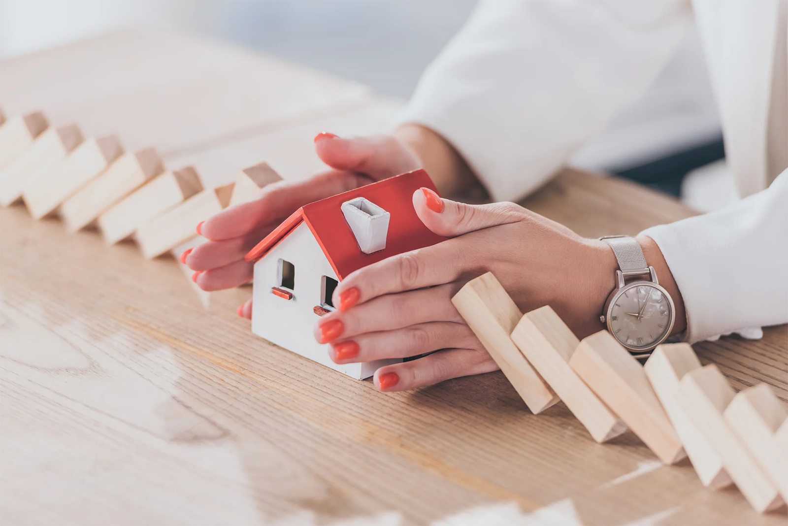 Cropped_20view_20of_20risk_20manager_20protecting_20house_20model_20from_20falling_20wooden_20blocks_20with_20hands Cropped_20view_20of_20risk_20manager_20protecting_20house_20model_20from_20falling_20wooden_20blocks_20with_20hands
