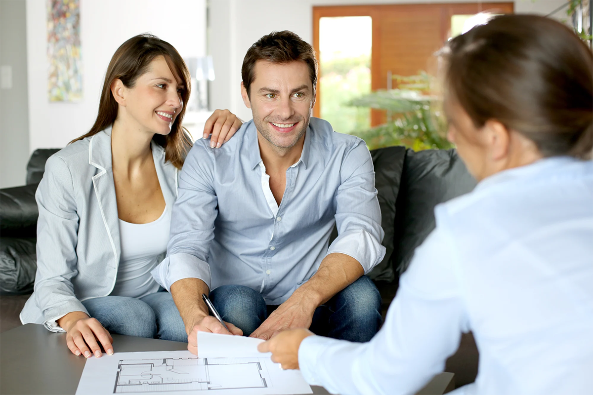 Couple_20signing_20financial_20terms_20for_20future_20property Couple_20signing_20financial_20terms_20for_20future_20property