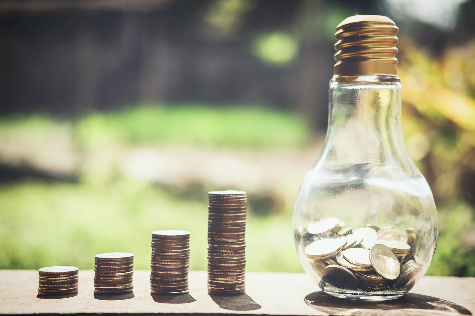 Stacking_20coins_20and_20money_20growing_20for_20saving_2c_20Coin_20in_20glass_20bottle Stacking_20coins_20and_20money_20growing_20for_20saving_2c_20Coin_20in_20glass_20bottle